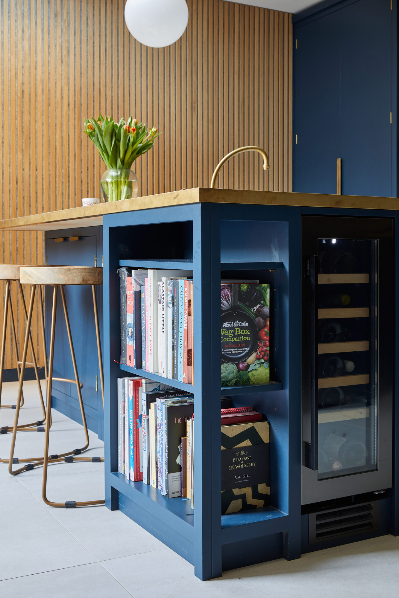 Open bookshelf inside bespoke kitchen island