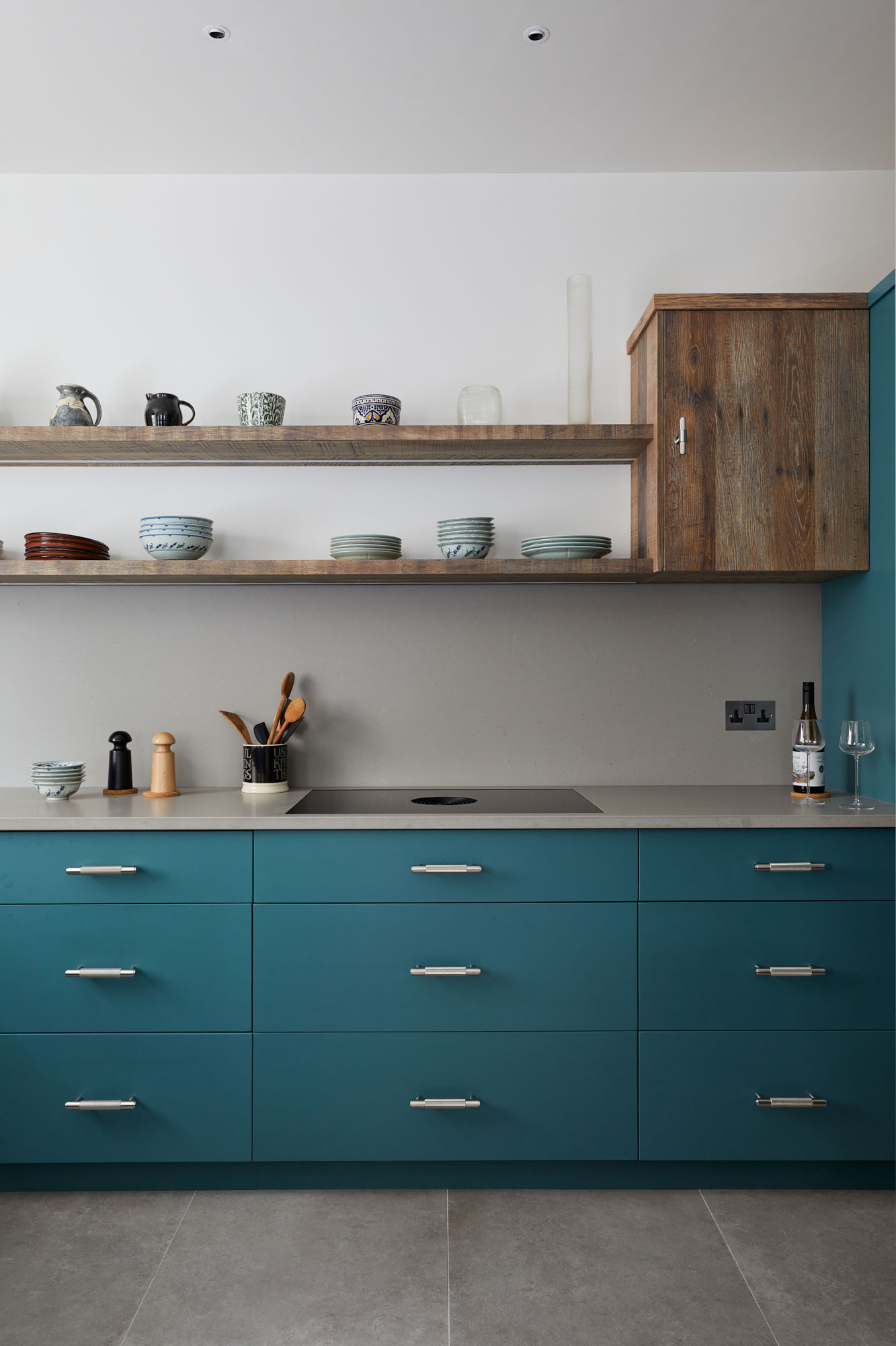 Teal blue painted kitchen units