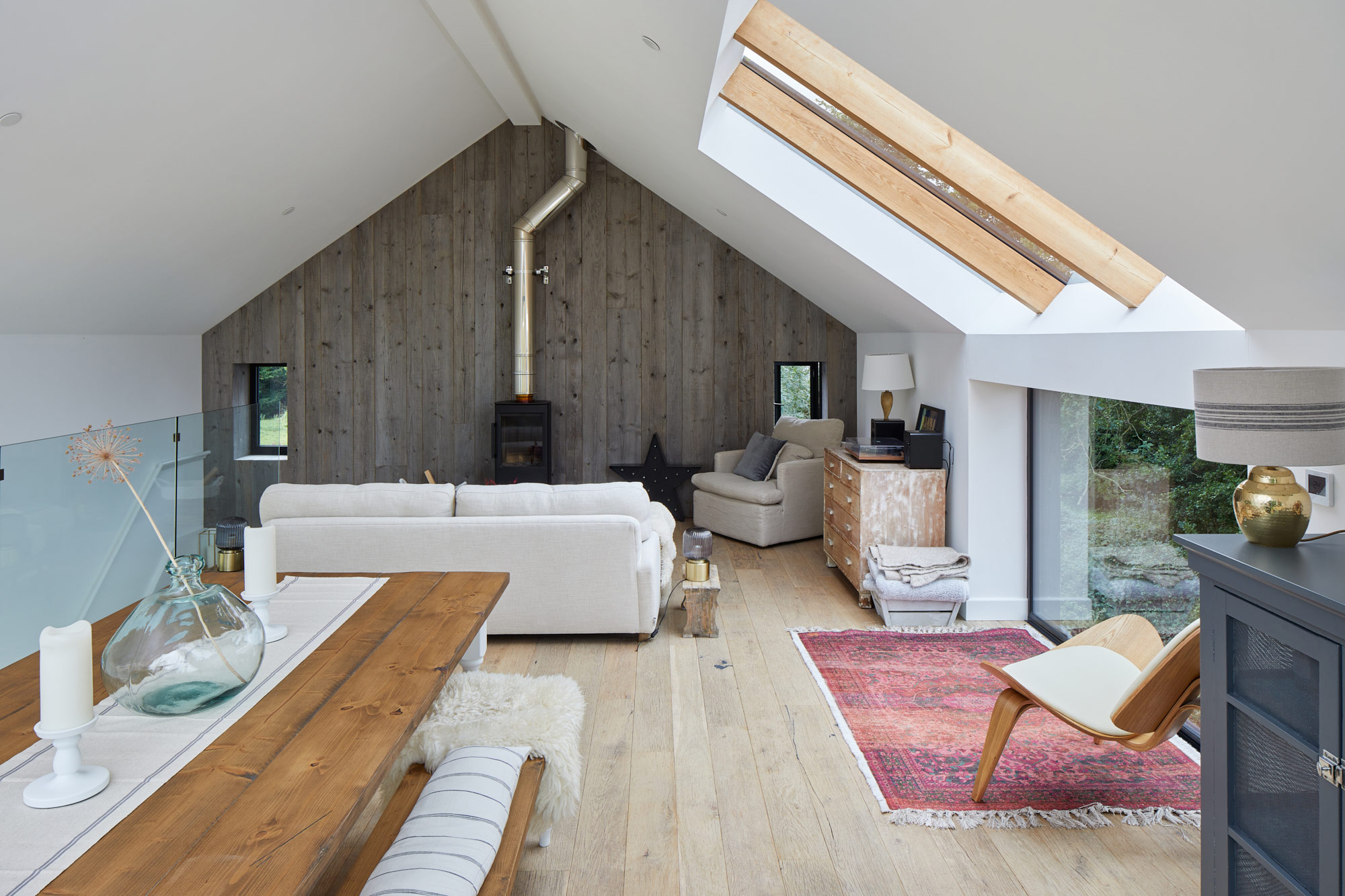 Reclaimed flooring and cladding inside renovated barn