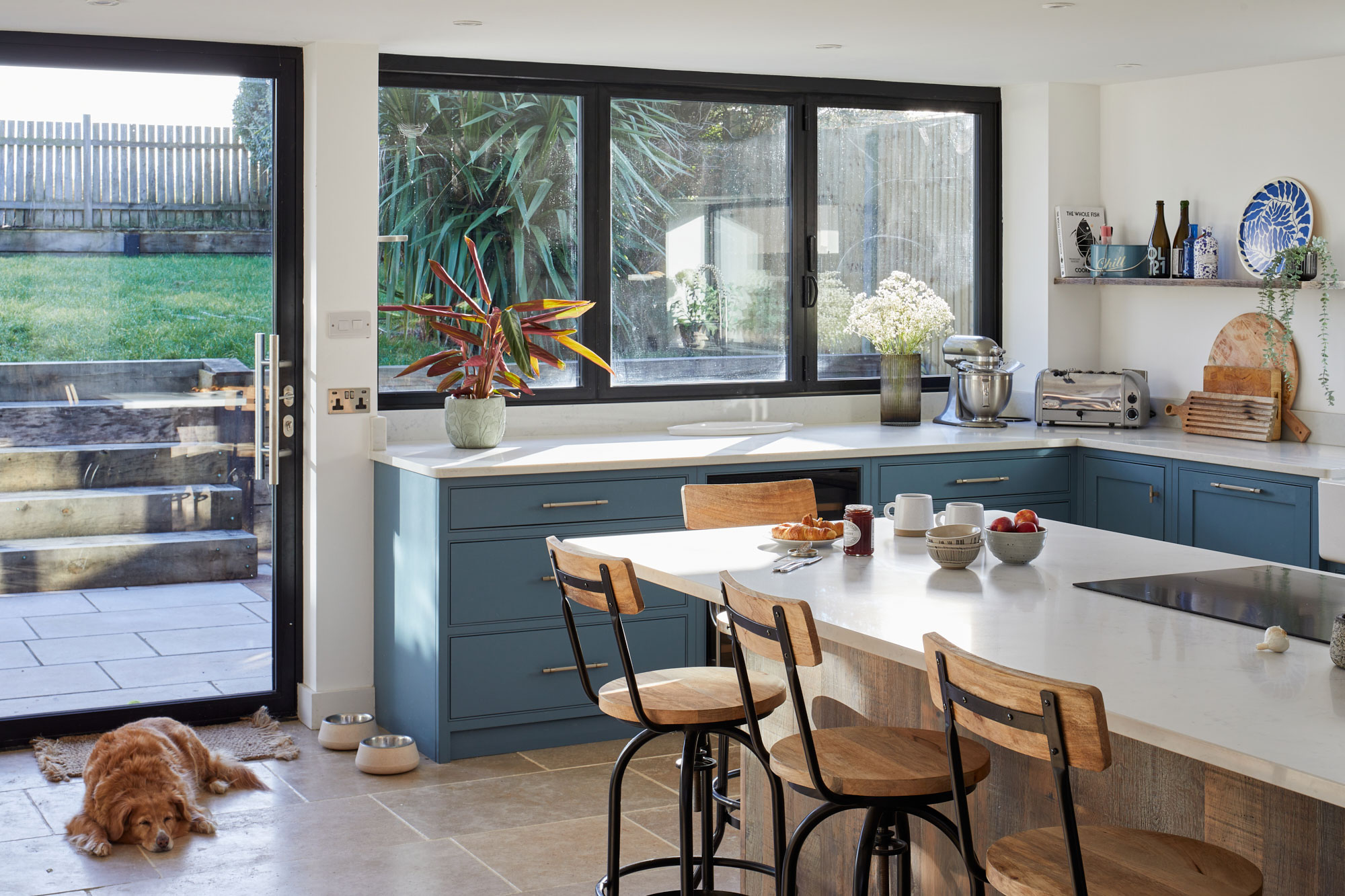 White quartz kitchen worktop flows to make breakfast bar