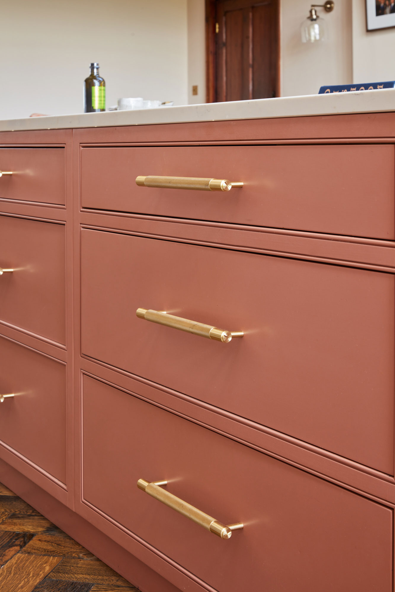 Buster & Punch heavy brass kitchen handles on pink drawers