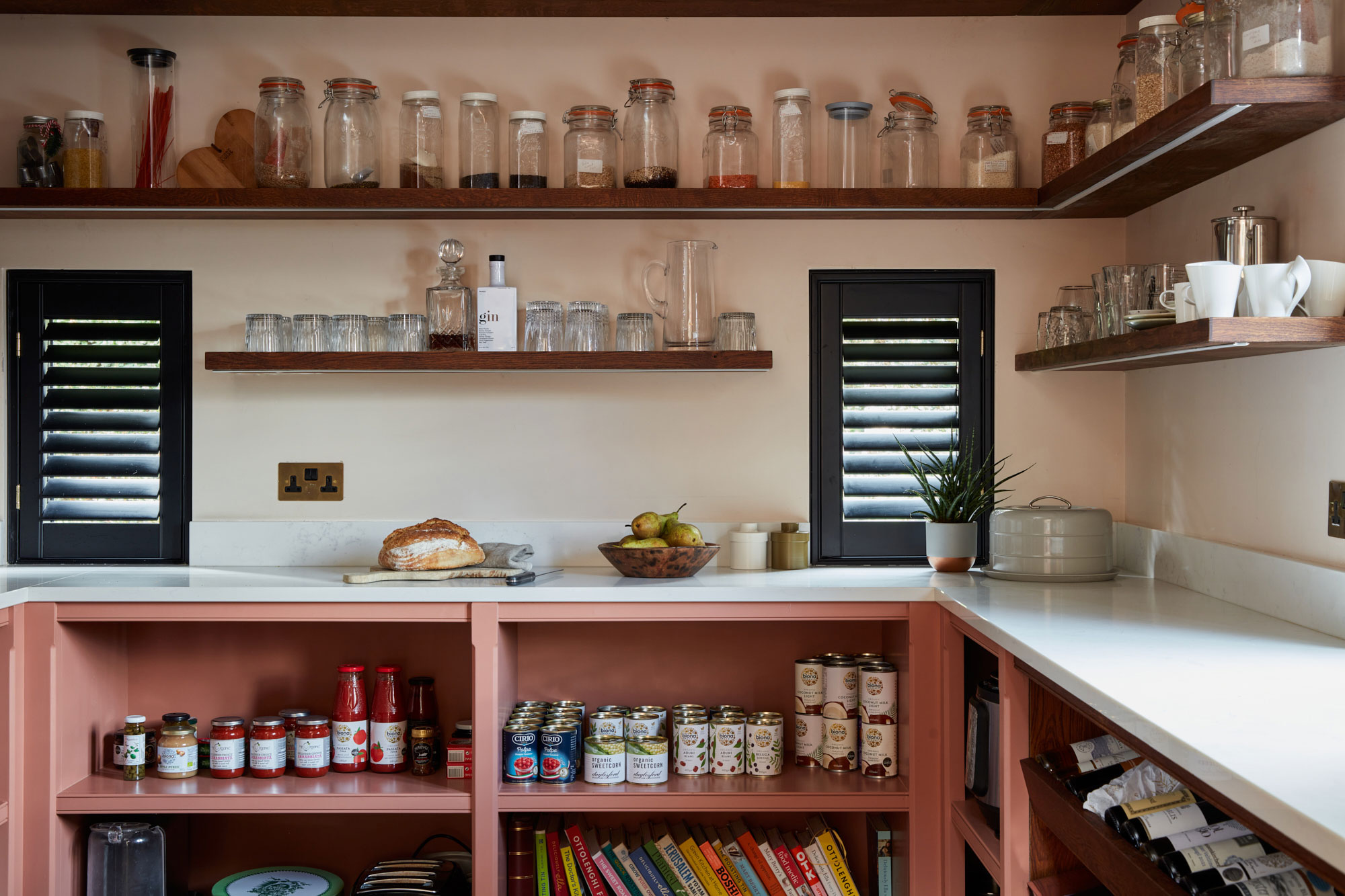 Pink painted walk in pantry