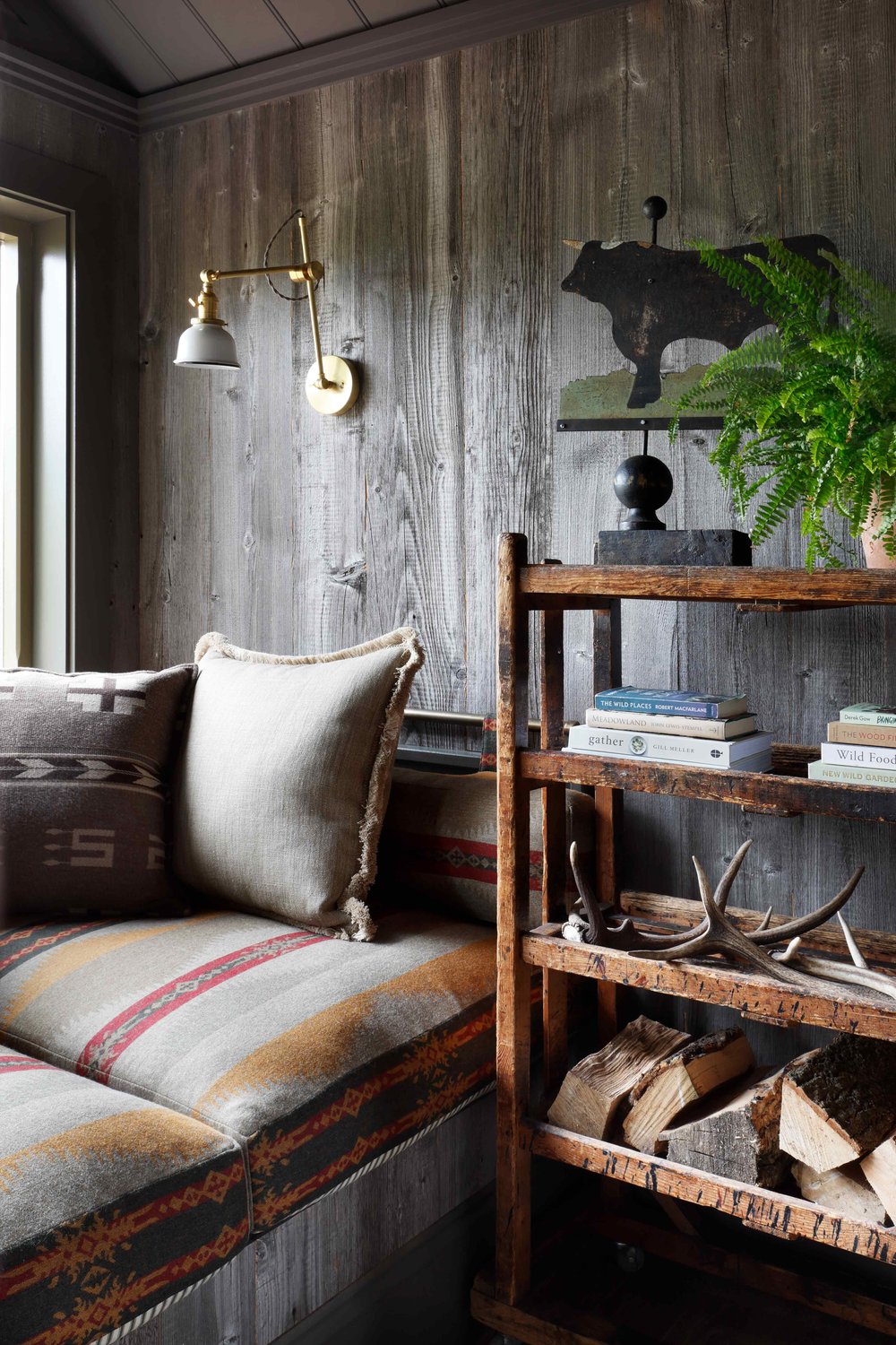 Rustic open bookshelves inside log cabin