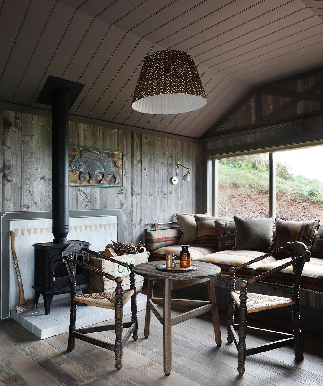 Dining table inside reclaimed log cabin