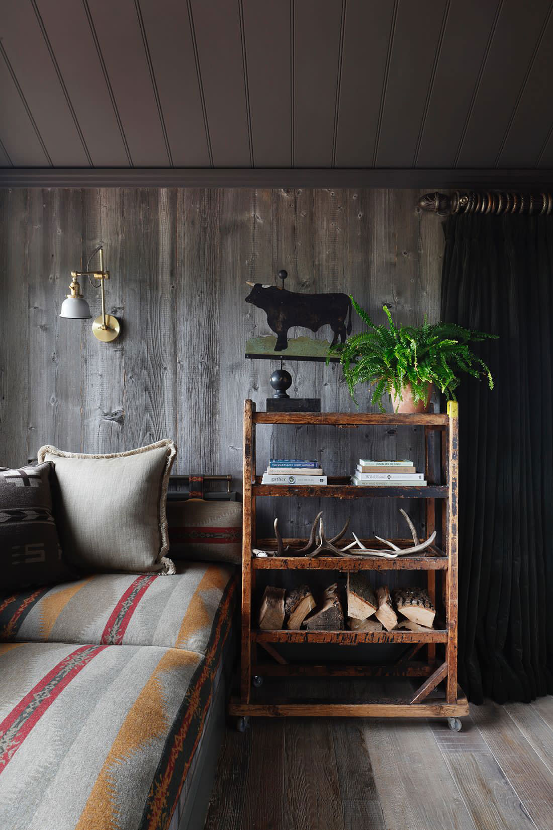 Silver cladding in reclaimed log cabin