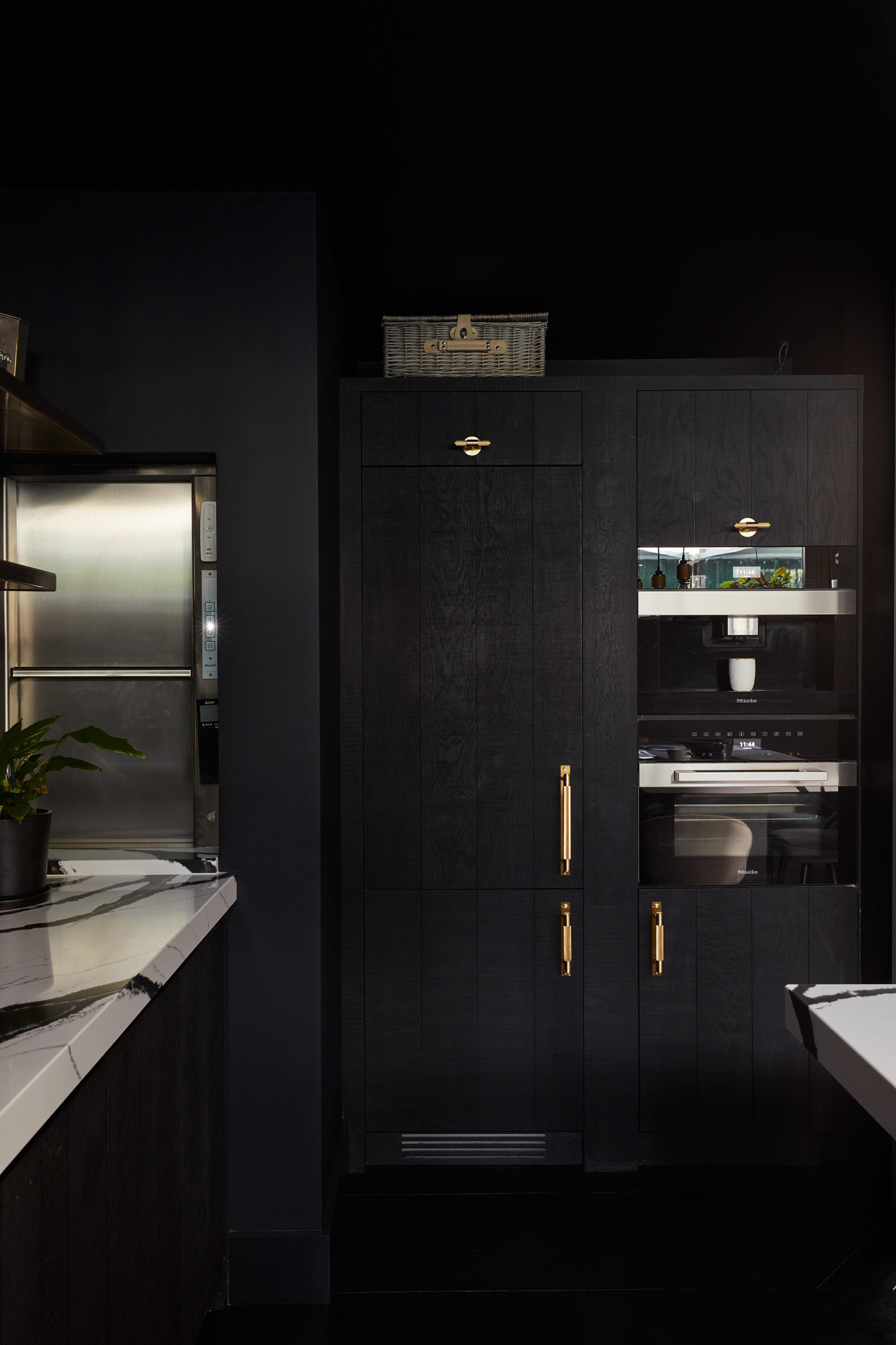 Tall integrated black oak kitchen cabinets