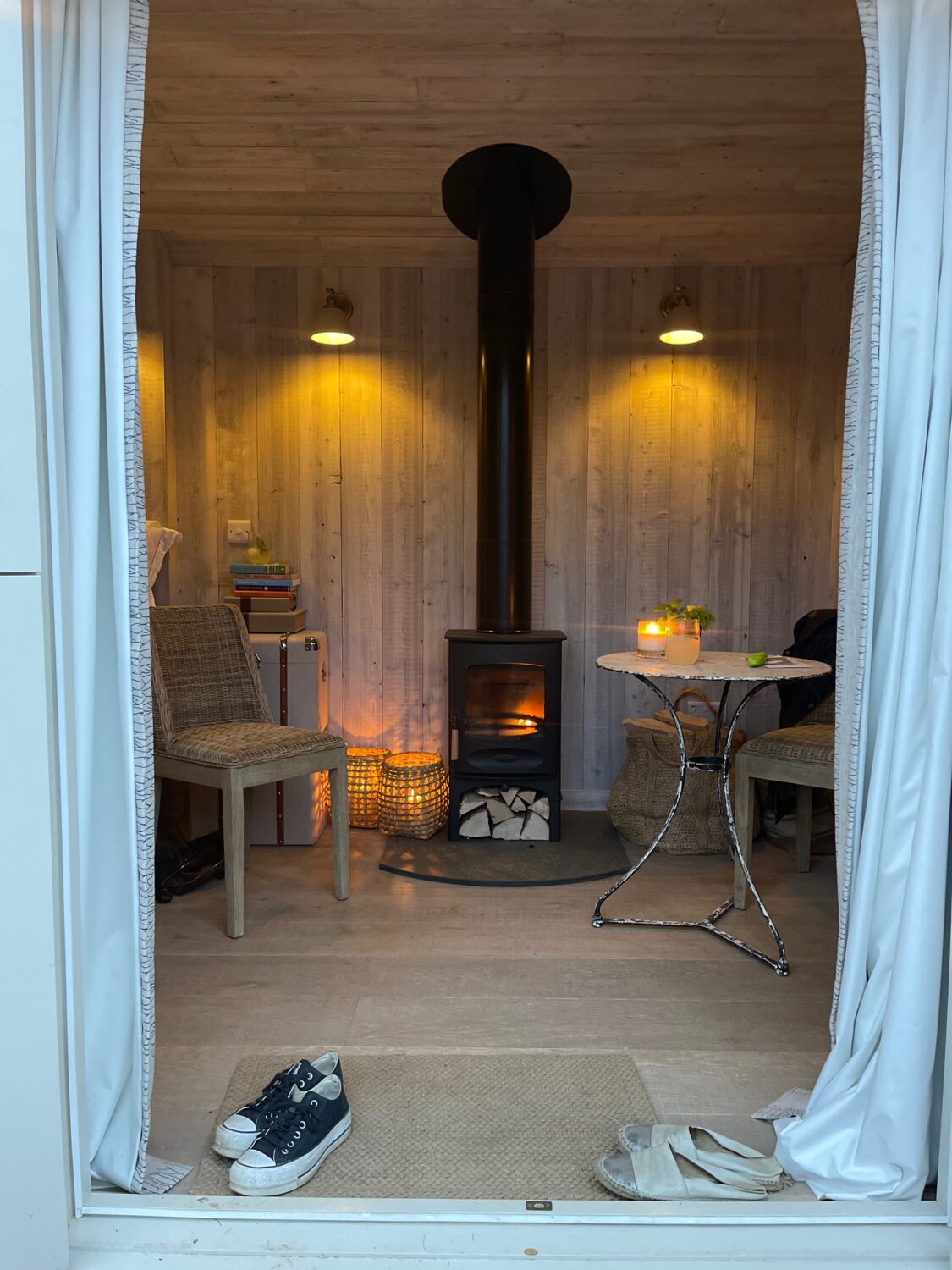 cozy cabin entrance with warm lights on