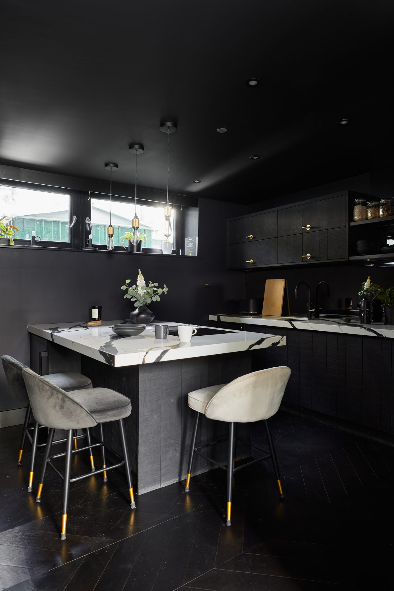 Black kitchen penisular cabinets