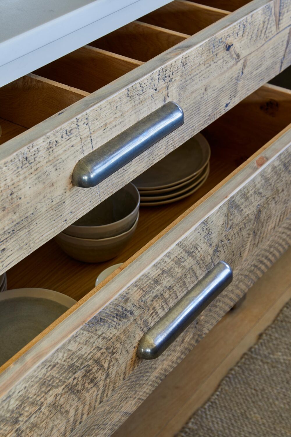 kitchen draw with plates and bowls