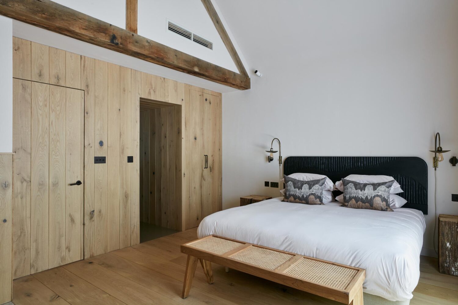 wood flooring and cladding in a hospitality project bedroom