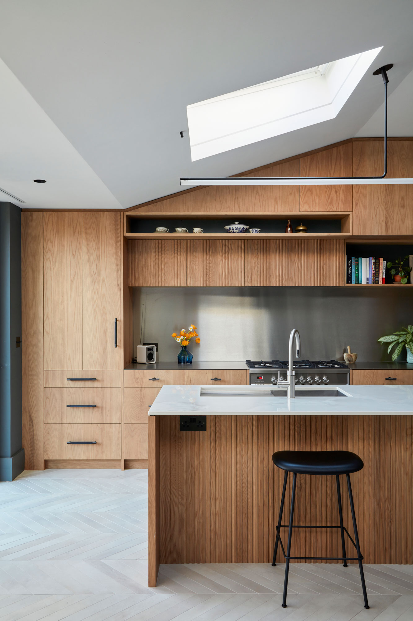 Modern open plan kitchen featuring ash finish