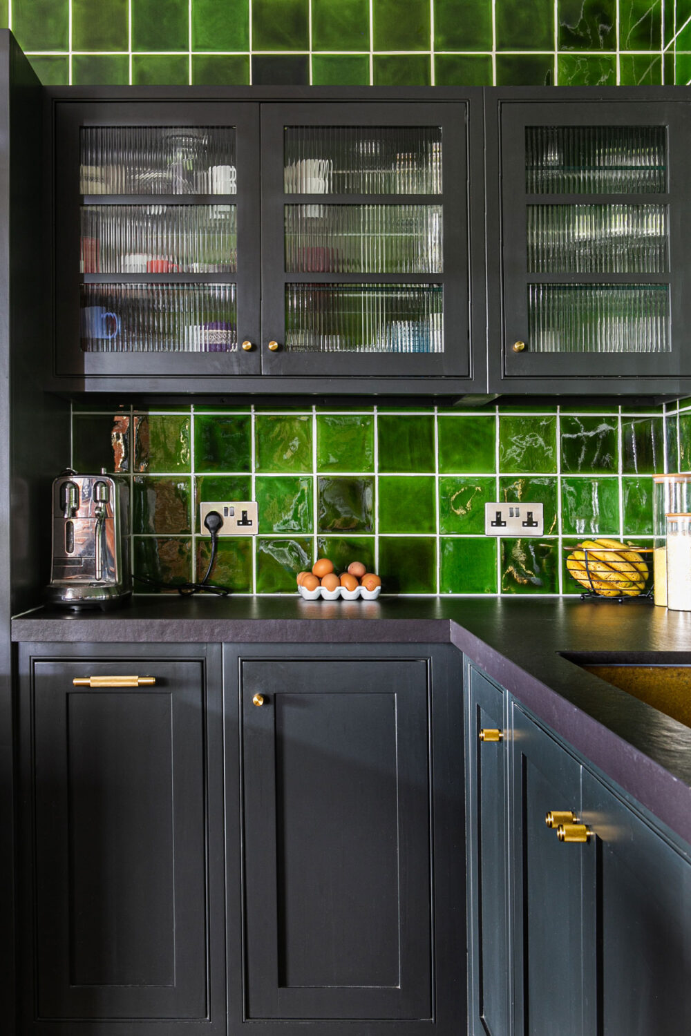 kitchen with green tiles as backsplash