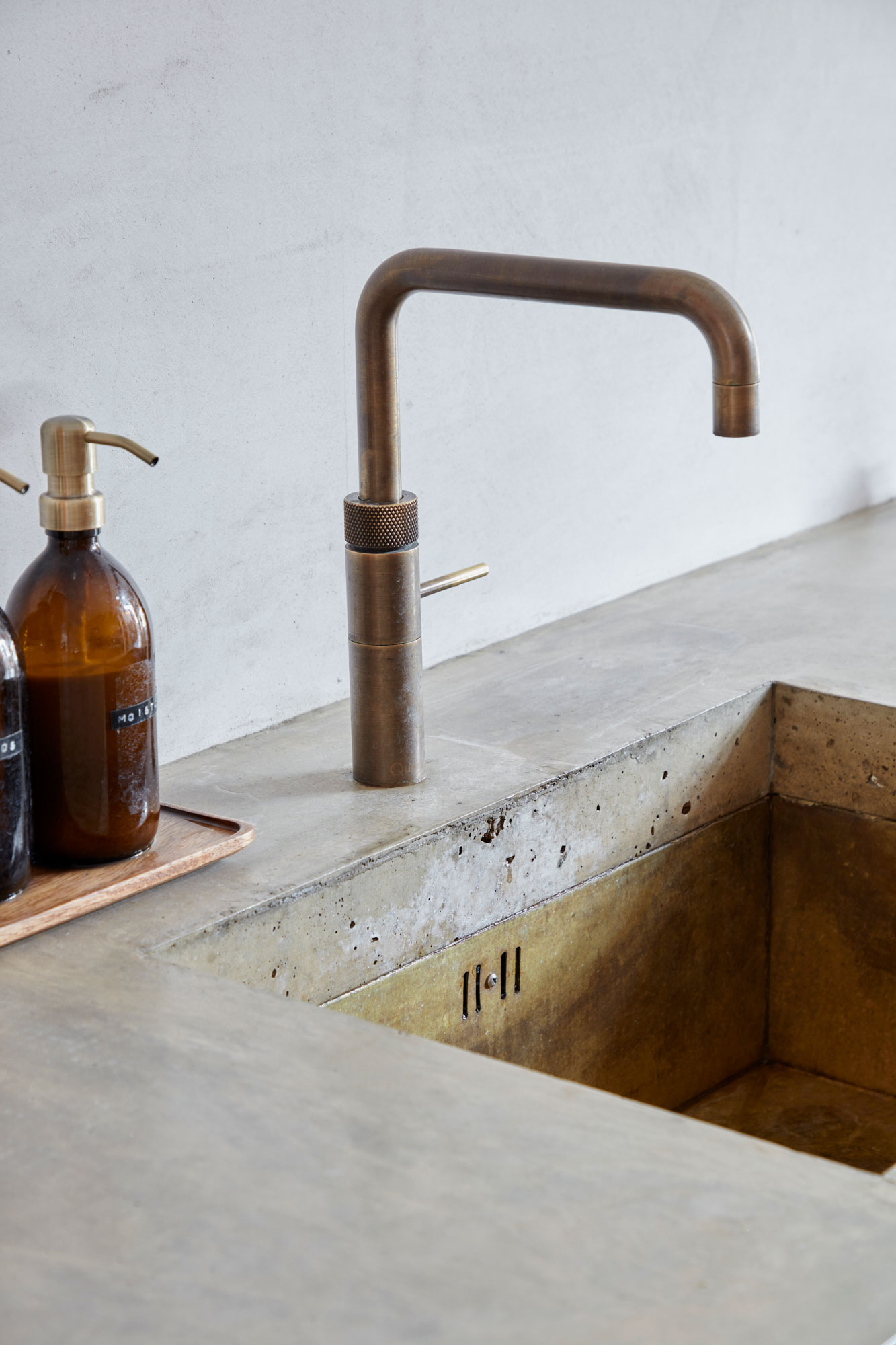 Aged brass tap and kitchen sink