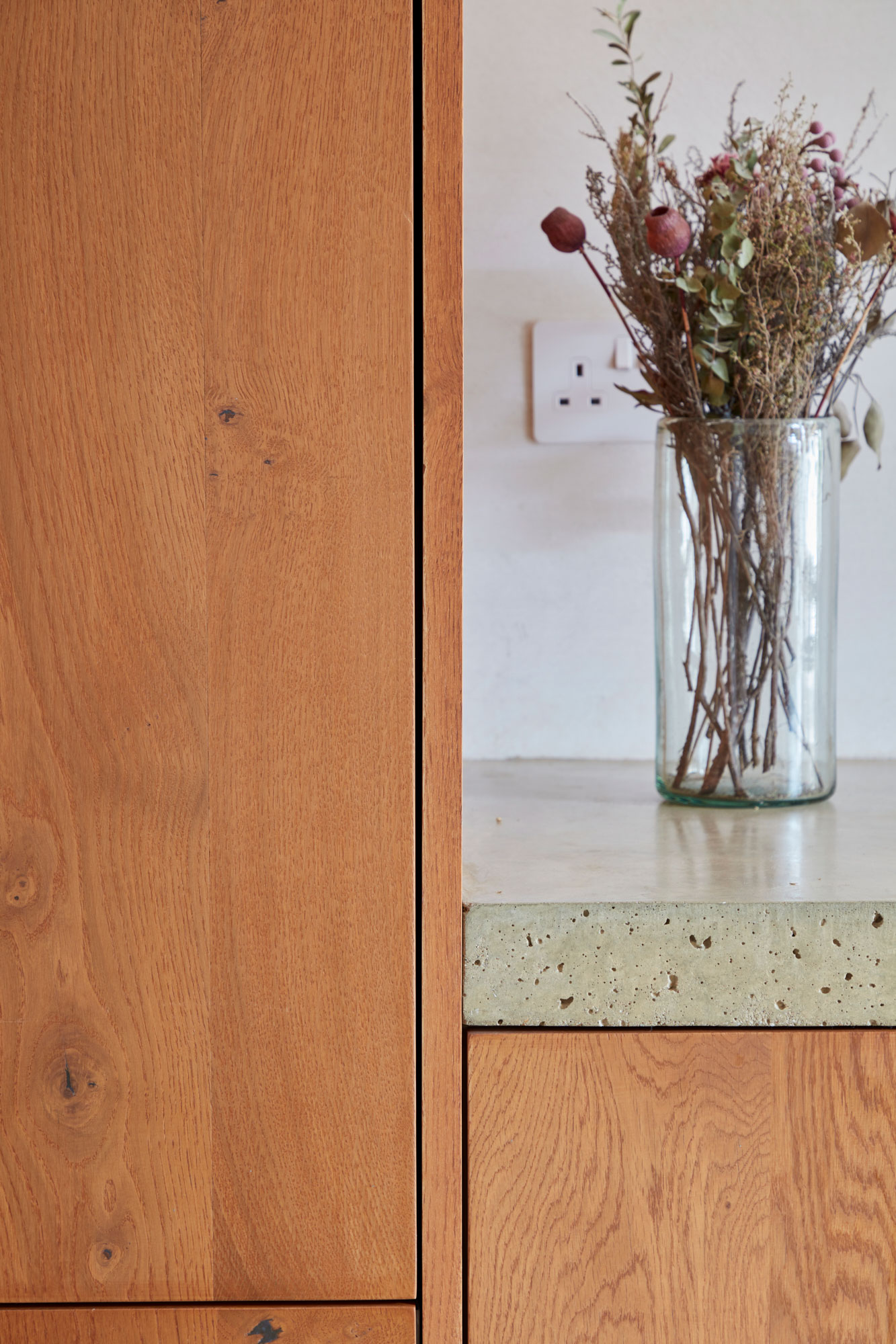 Engineered oak cabinets with solid concrete worktops