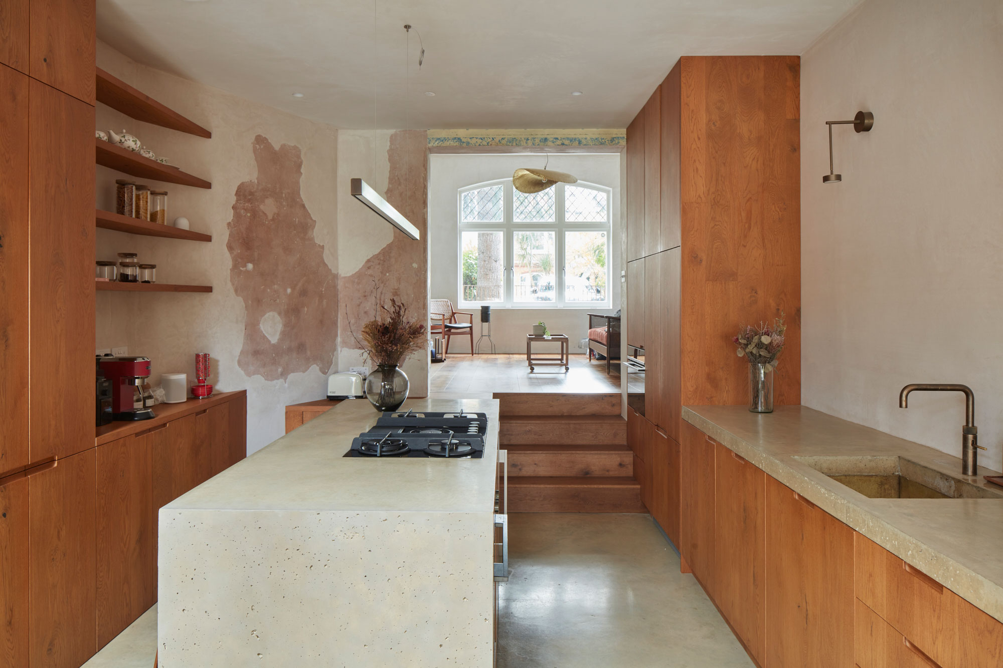 Modern kitchen design with concrete worktops and oak cabinetry