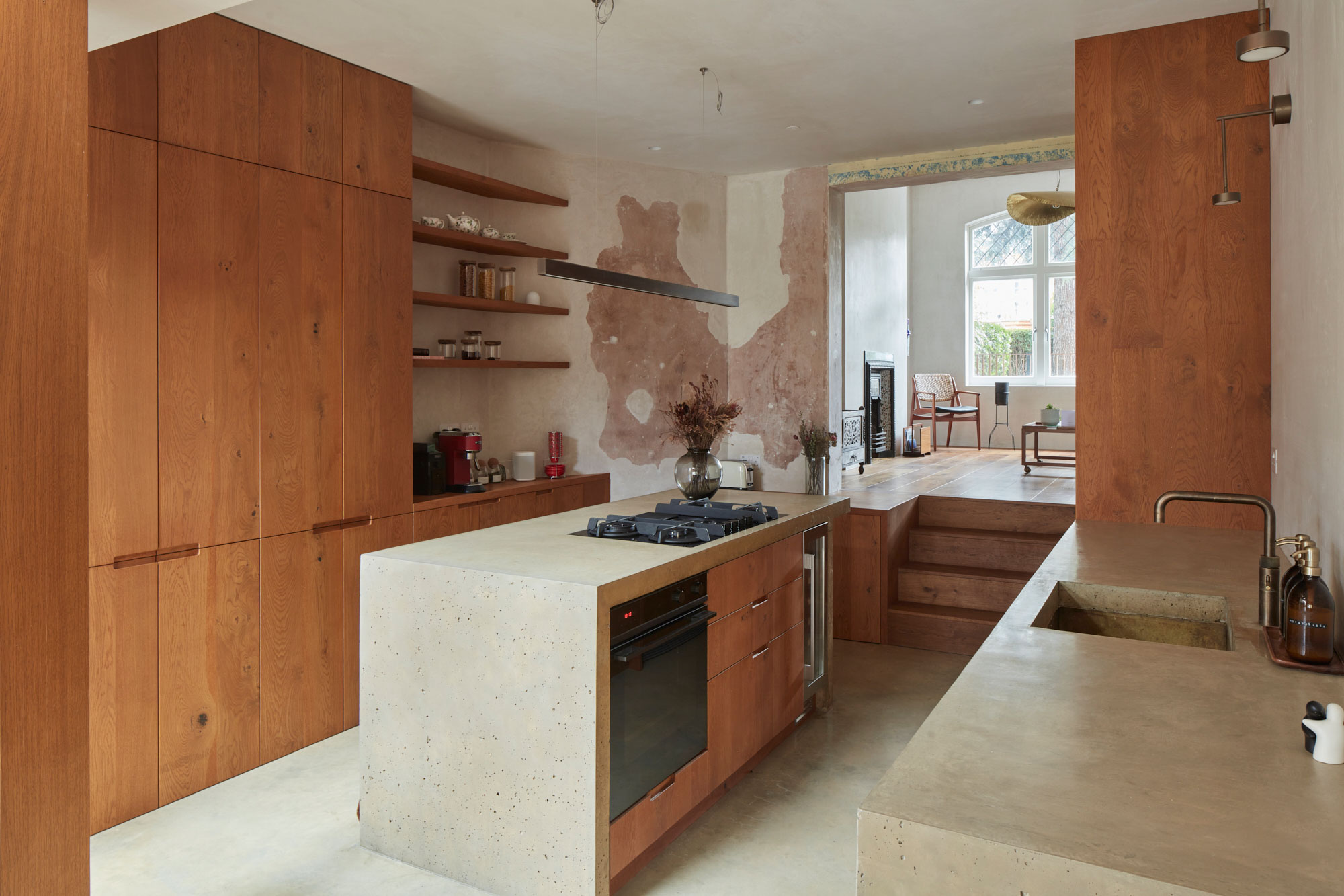 Open plan kitchen with concrete kitchen island