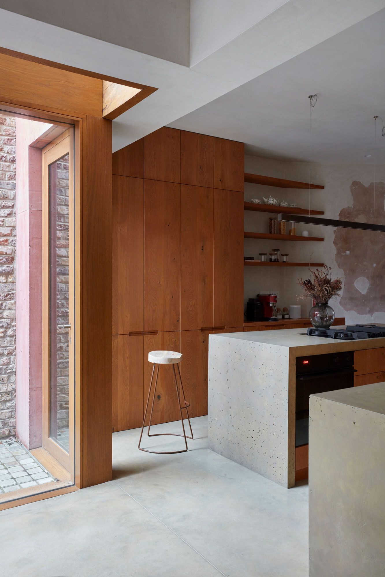 Tall integrated Fisher & Paykel American fridge in engineered oak cabinets