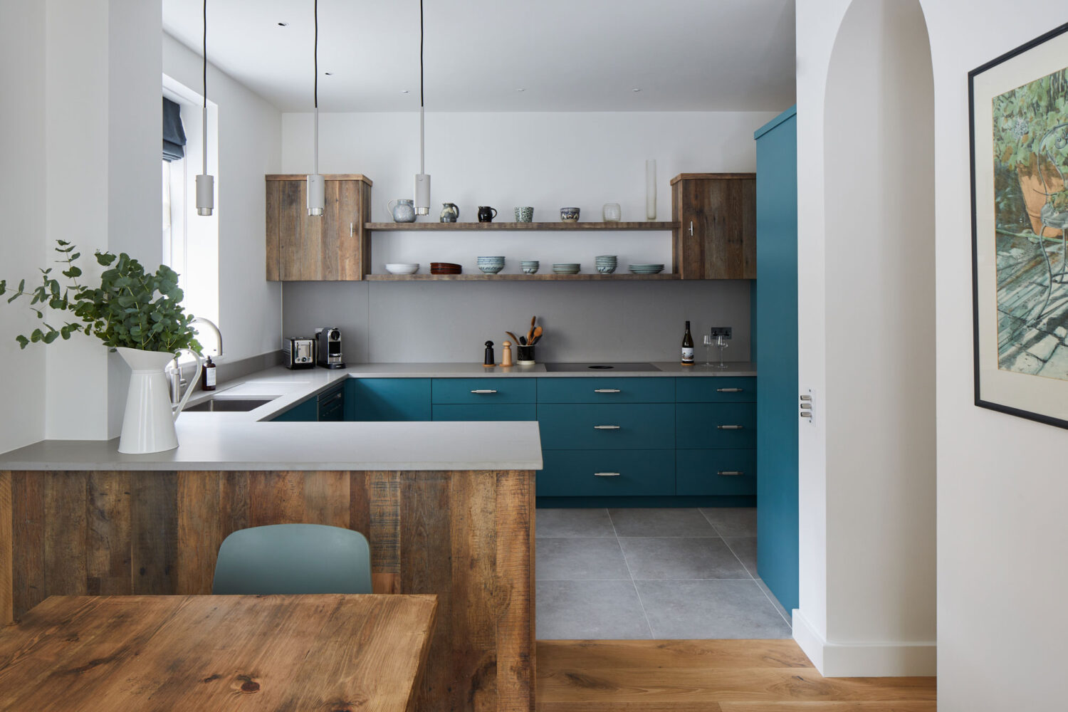 blue shaker style kitchen with open shelving