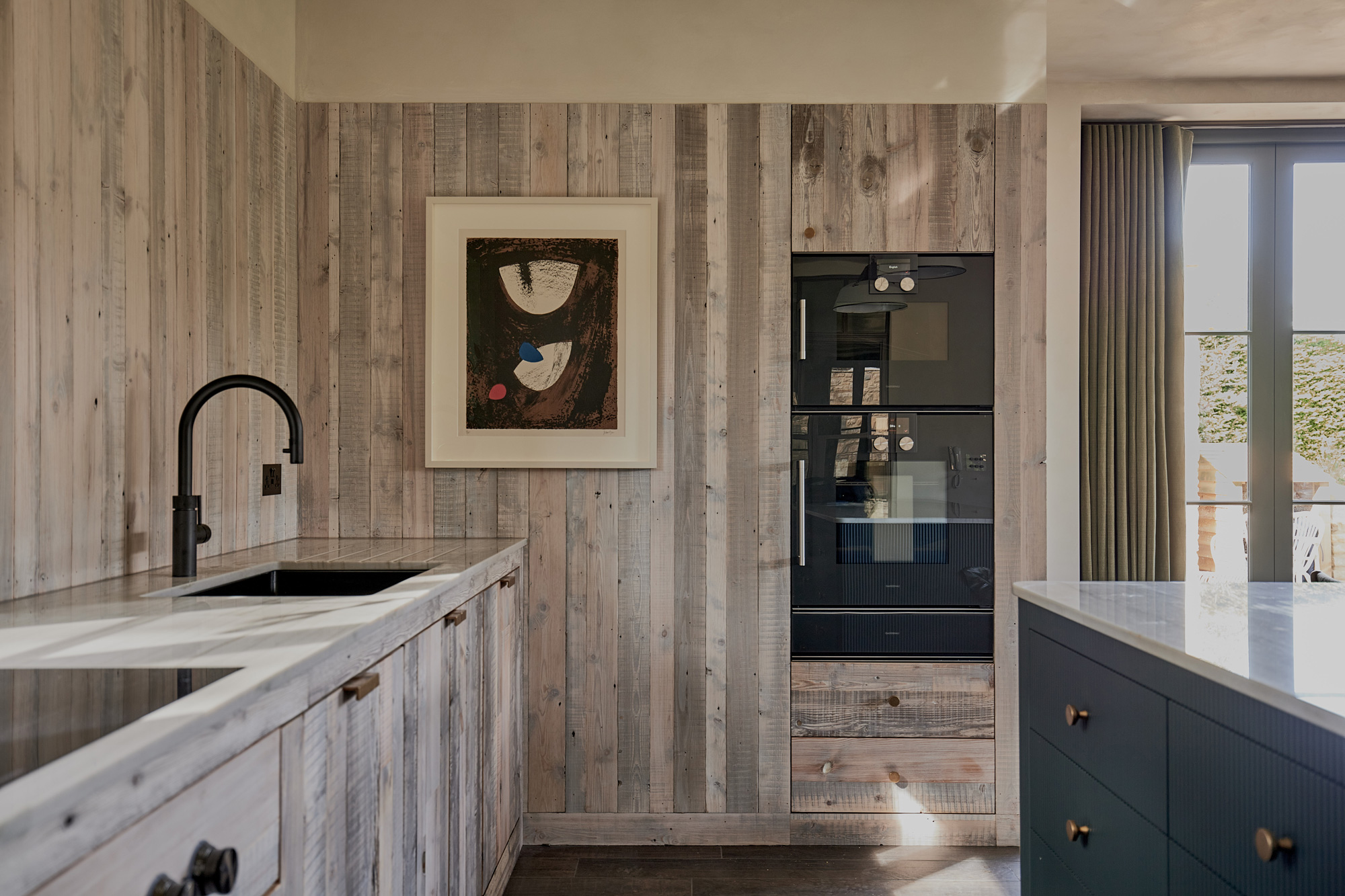 reclaimed rustic white mill board cladding in kitchen design