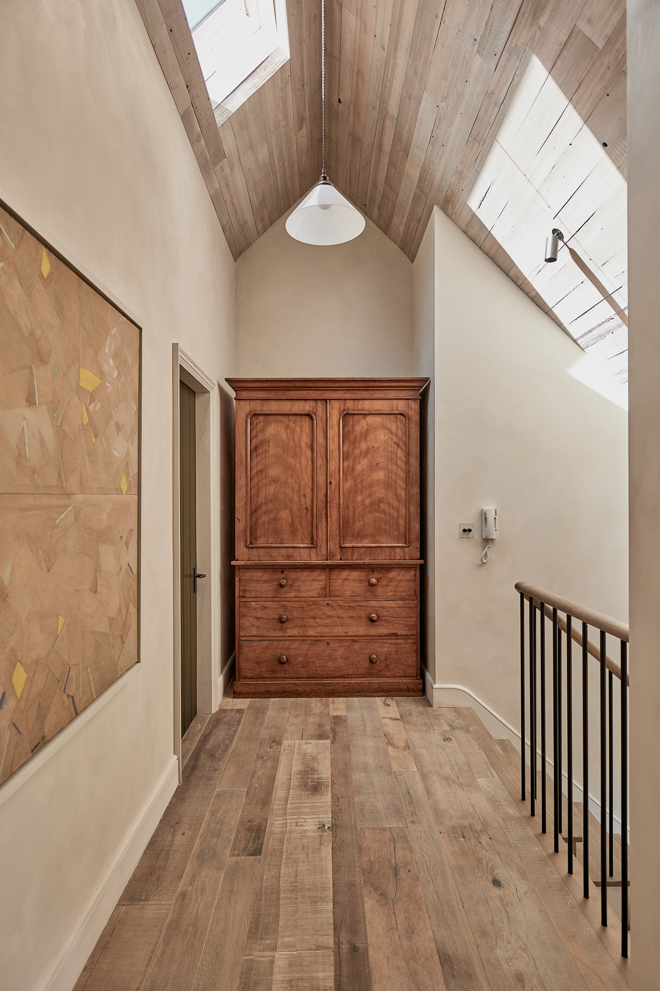 hallway styled with reclaimed wood cladding by The Main Company