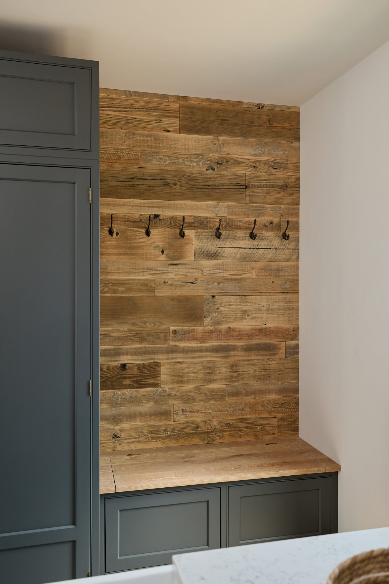 Utility and boot room with reclaimed wall cladding