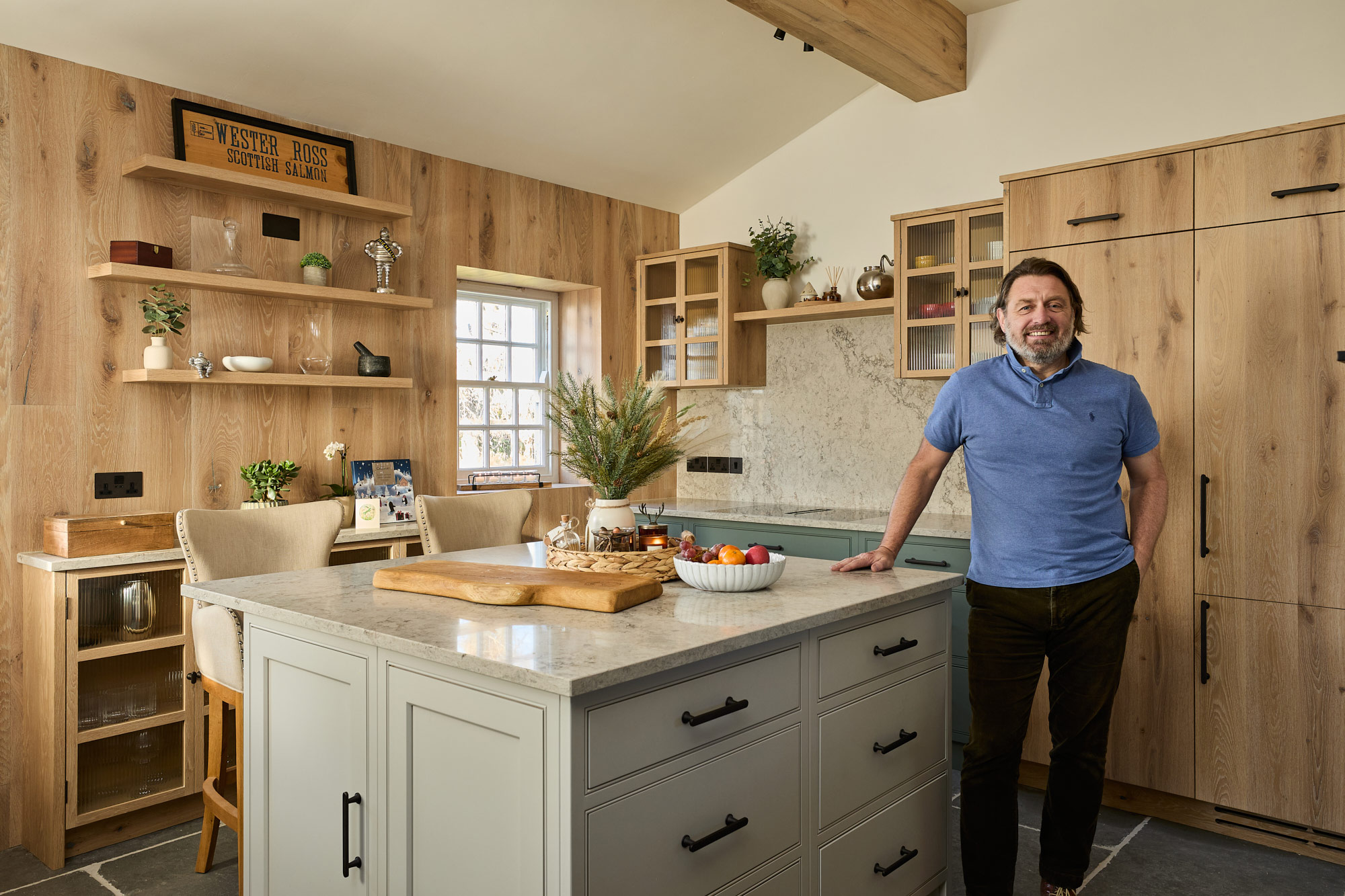 Shaun stands in his bespoke kitchen